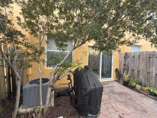 view of patio / terrace featuring central air condition unit and grilling area