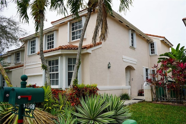 back of house with a garage