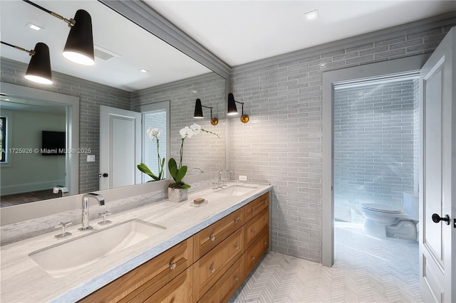 bathroom featuring toilet, vanity, and tile patterned floors