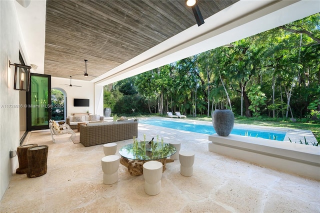 view of patio / terrace featuring ceiling fan and an outdoor living space