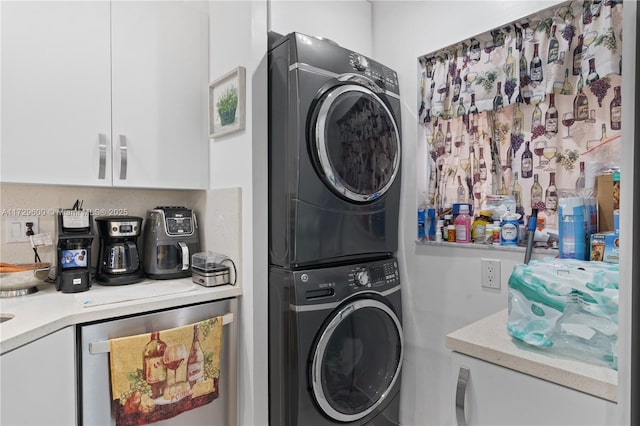 clothes washing area featuring stacked washing maching and dryer