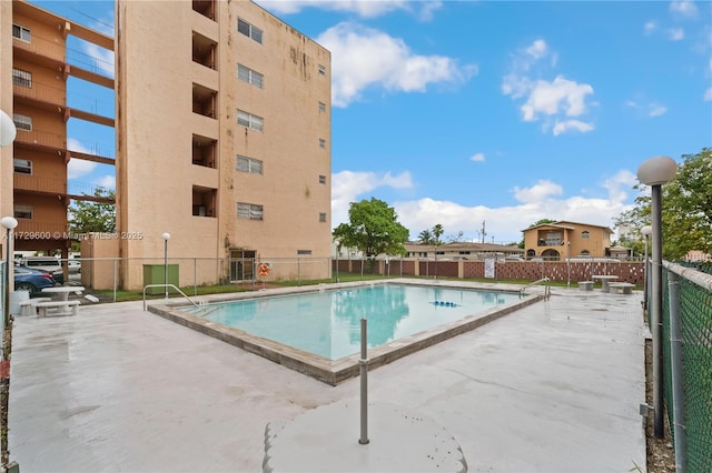 view of swimming pool with a patio