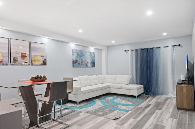 living room with light hardwood / wood-style flooring