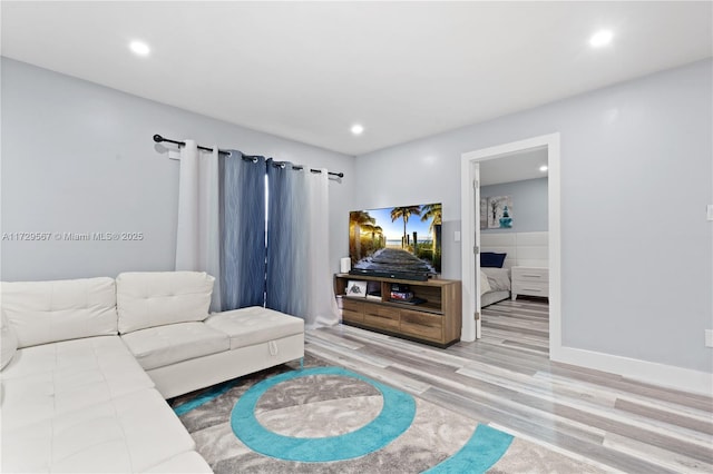 living room with light hardwood / wood-style flooring