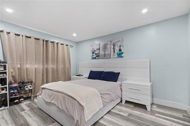 bedroom with light hardwood / wood-style flooring