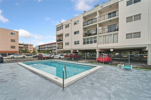 view of pool featuring a patio area