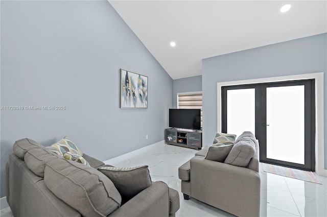 living room with french doors and vaulted ceiling