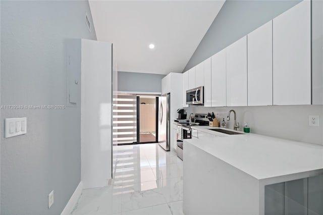 kitchen featuring kitchen peninsula, stainless steel appliances, high vaulted ceiling, white cabinets, and sink