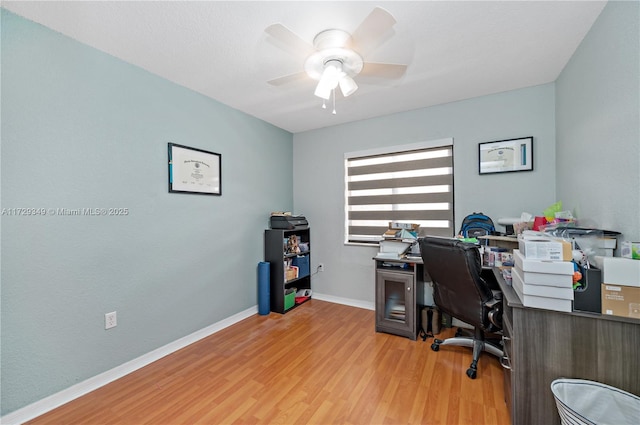 office area with ceiling fan and light wood-type flooring