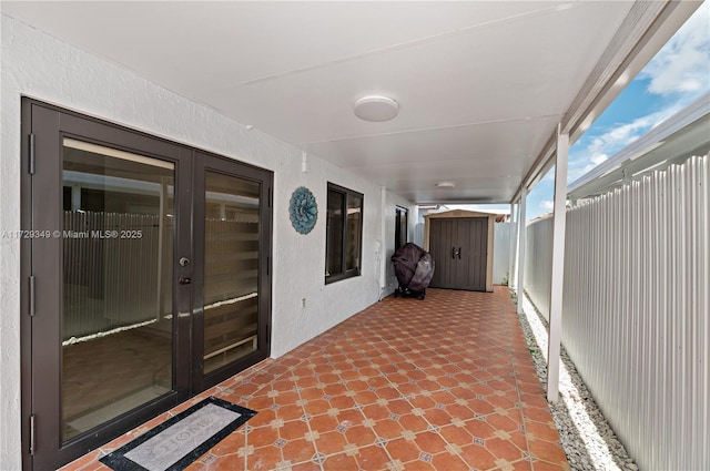 view of patio / terrace featuring a storage unit