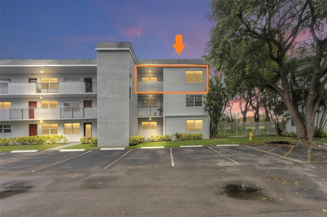 view of outdoor building at dusk