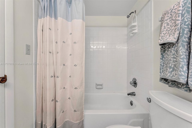 bathroom with toilet and shower / bathtub combination with curtain