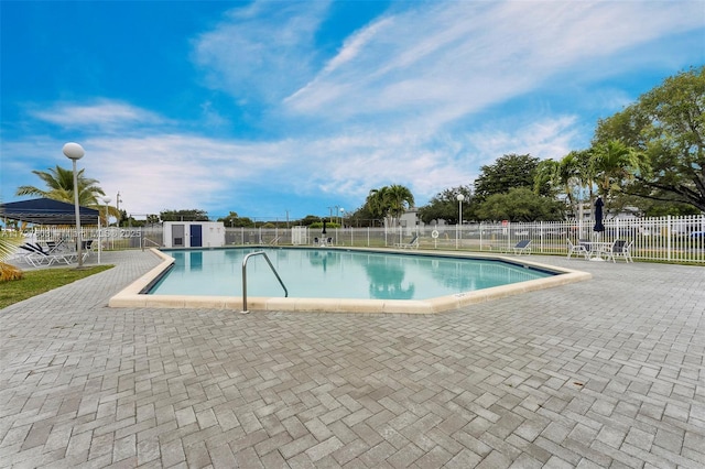 view of swimming pool with a patio