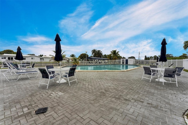 view of swimming pool featuring a patio area