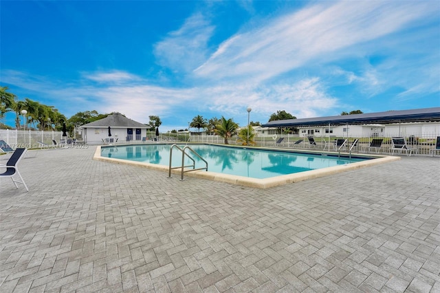 view of swimming pool with a patio