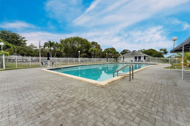 view of swimming pool with a patio area