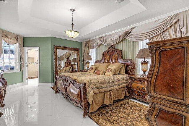 bedroom with light tile patterned flooring, a tray ceiling, and multiple windows