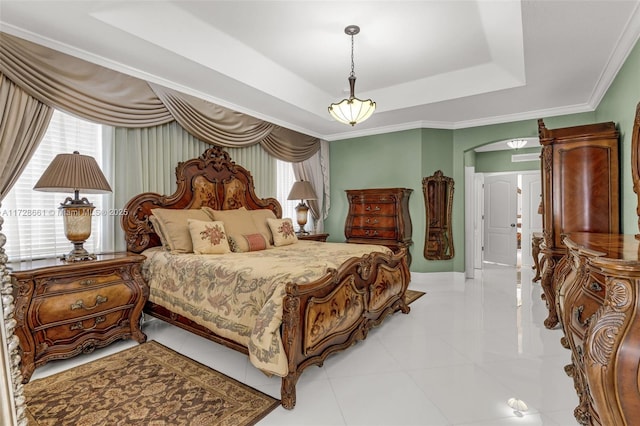 bedroom featuring light tile patterned flooring, ornamental molding, and a raised ceiling