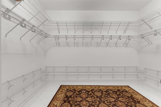 walk in closet featuring tile patterned floors