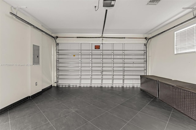 garage with electric panel and a garage door opener