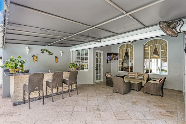 view of patio / terrace featuring an outdoor hangout area and exterior bar