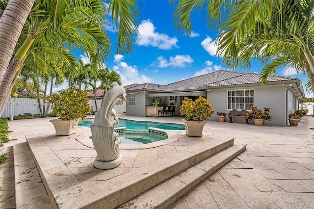 view of pool featuring an in ground hot tub and a patio area