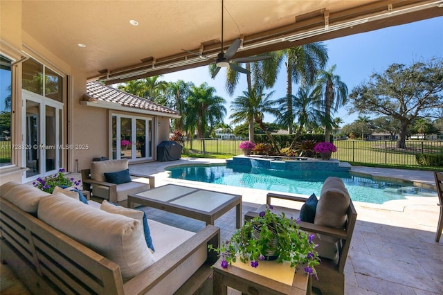 view of swimming pool featuring a patio, outdoor lounge area, area for grilling, ceiling fan, and french doors