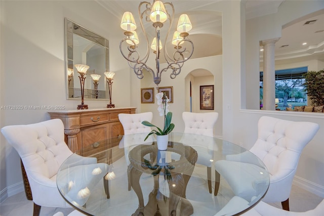 dining area featuring crown molding and a chandelier