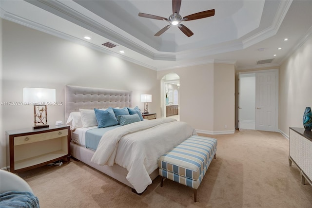 carpeted bedroom featuring crown molding, a raised ceiling, and ceiling fan