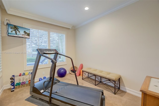 workout room featuring light carpet and crown molding