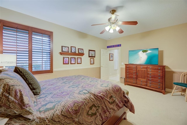 bedroom with light colored carpet and ceiling fan