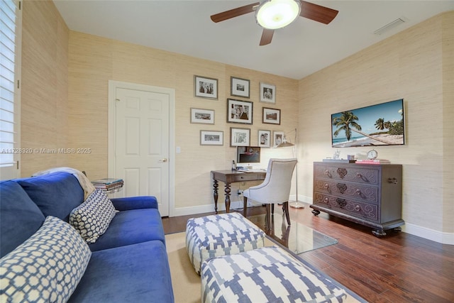 living room with hardwood / wood-style flooring and ceiling fan