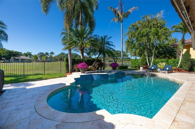 view of pool featuring an in ground hot tub and a patio