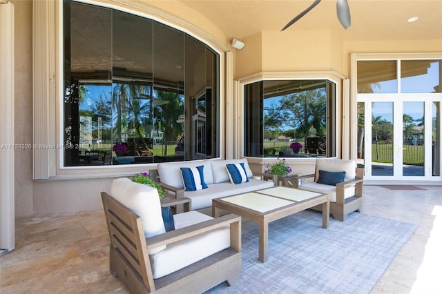 view of patio / terrace with french doors, ceiling fan, and an outdoor hangout area