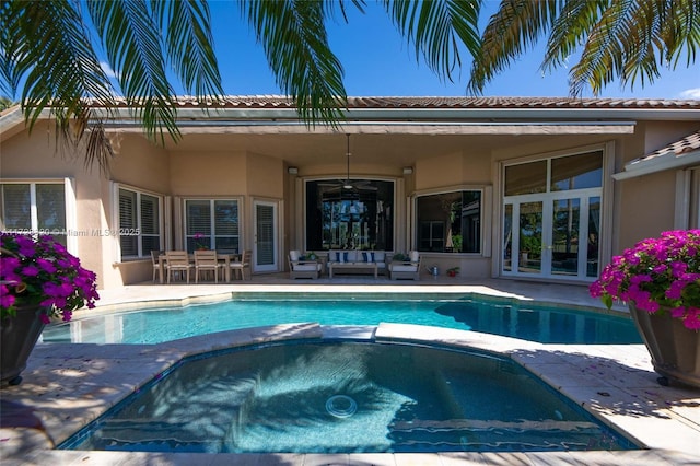 view of swimming pool with an outdoor living space and a patio area