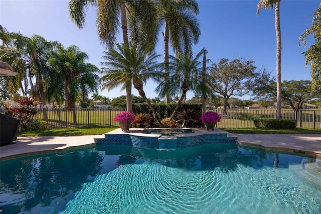 view of swimming pool featuring an in ground hot tub