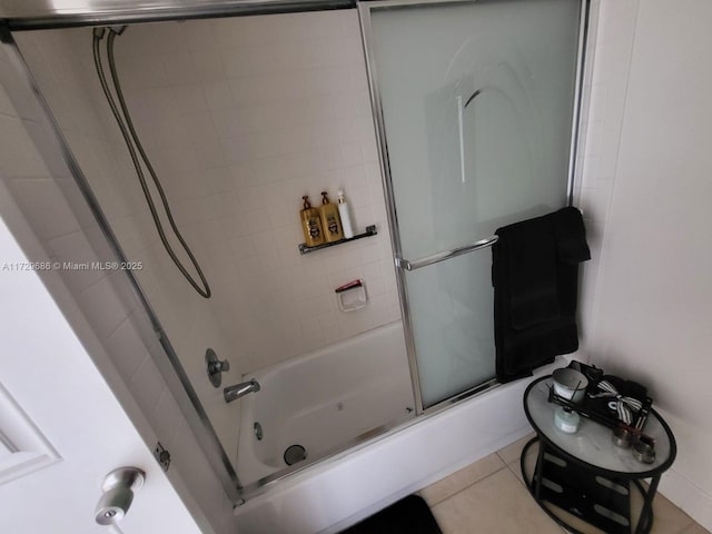 bathroom with tile patterned floors and enclosed tub / shower combo