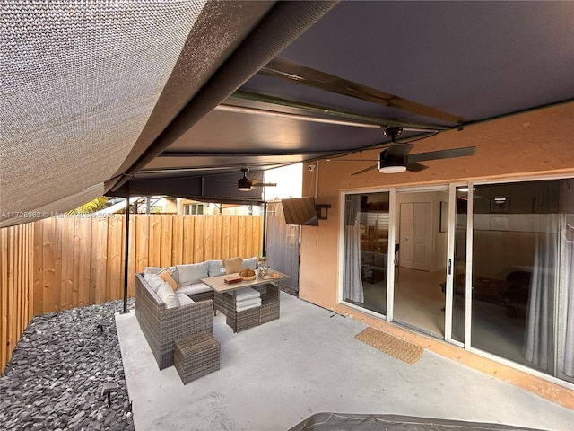 view of patio featuring ceiling fan and an outdoor living space