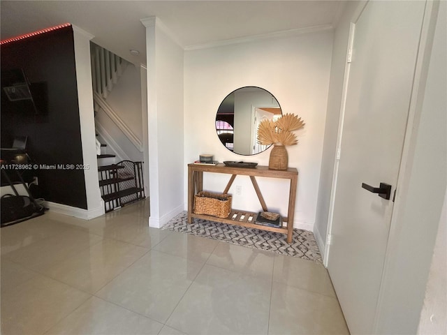 hall featuring light tile patterned floors and ornamental molding