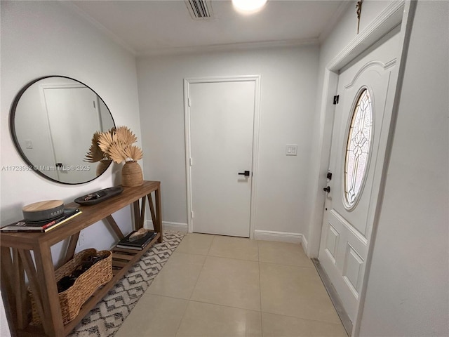 entryway with light tile patterned floors