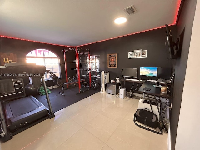 workout room with tile patterned floors