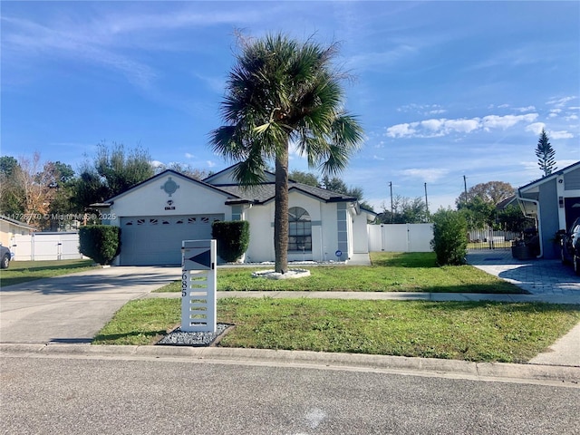 view of front of house featuring a garage and a front yard