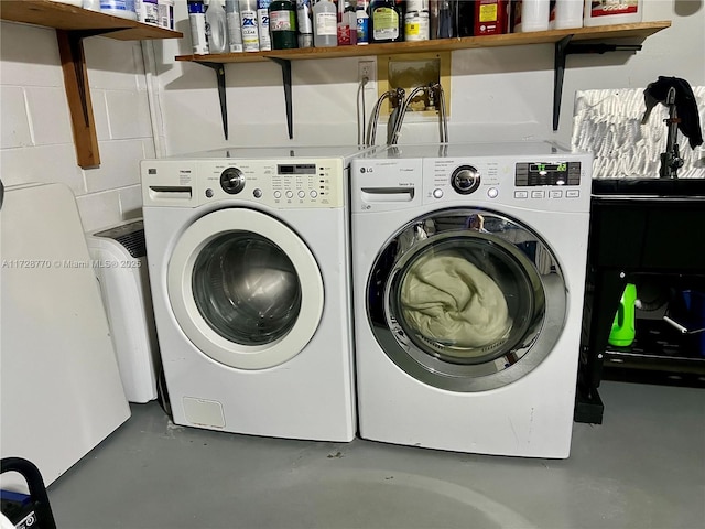 washroom featuring washer and dryer