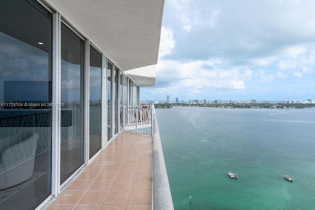 balcony featuring a water view