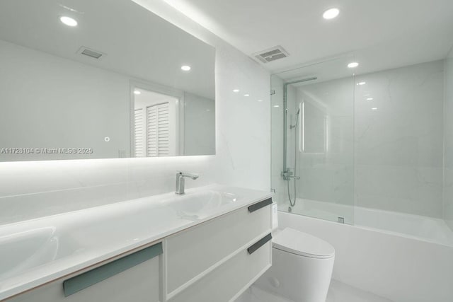 full bathroom with toilet, bathing tub / shower combination, and vanity