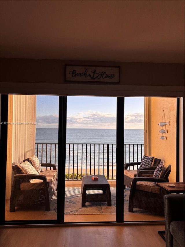 interior space featuring a water view and a view of the beach