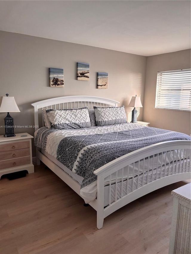 bedroom with hardwood / wood-style floors