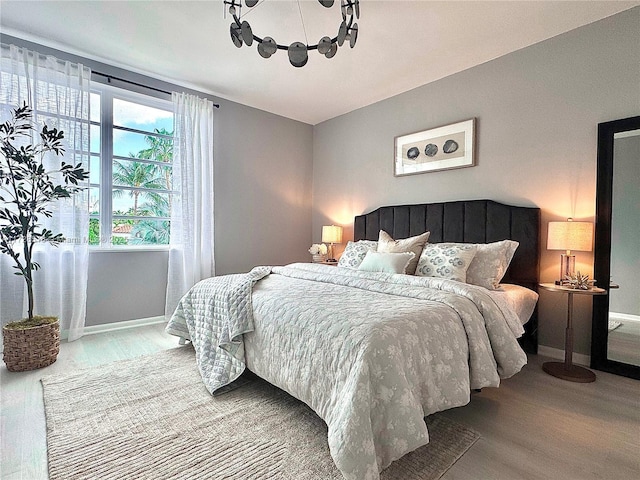 bedroom with wood-type flooring