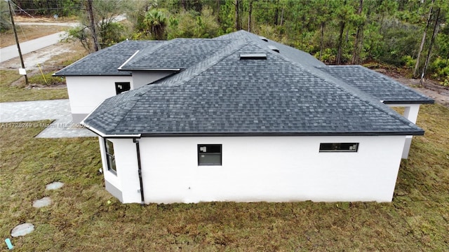 view of side of property featuring a yard