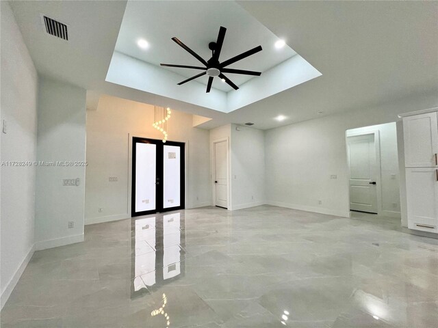 kitchen featuring ceiling fan, stainless steel appliances, a kitchen island, pendant lighting, and white cabinets